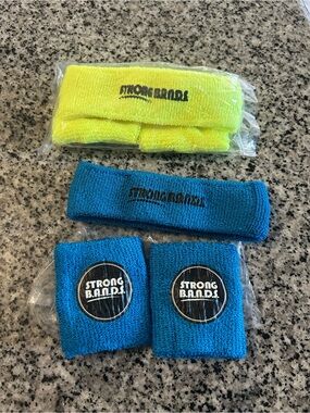 NEW - wristbands branded with "STRONG B.A.N.D.S."